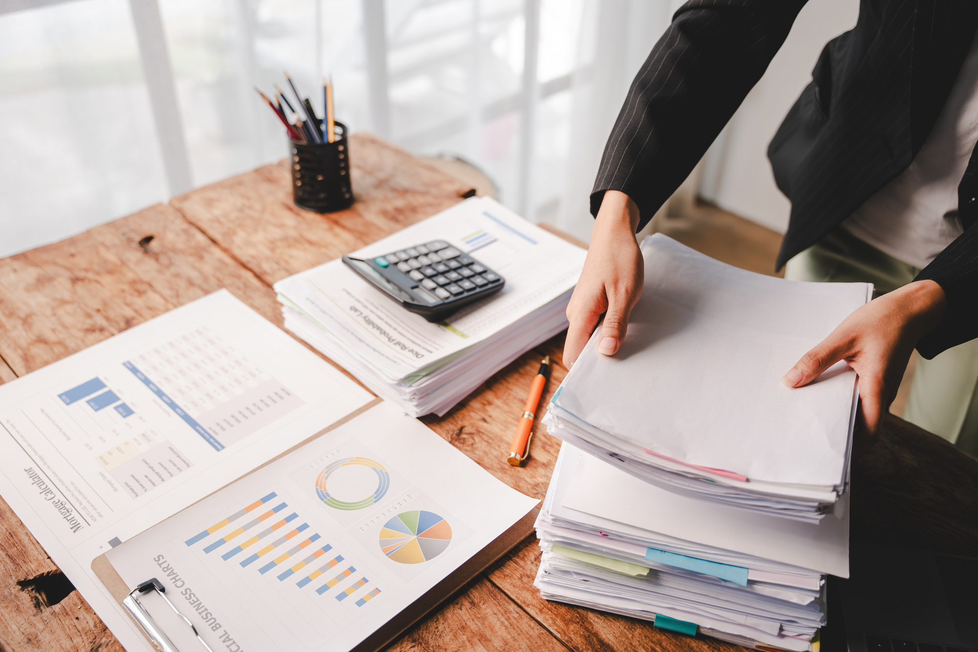 employees_who_work_with_a_lot_of_documents_searching_for_documents_accounting_for_income_expenses_tax_records_and_hard_work